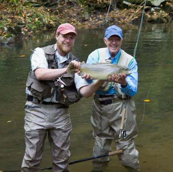 Two Fisherman Holding Fish