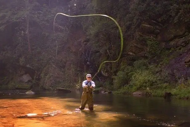 Man Fly Fishing in a River